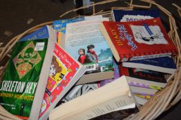 A basket of assorted reading books etc