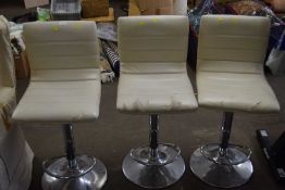 Three faux leather and aluminium bar stools