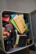 A vintage suitcase and assorted contents
