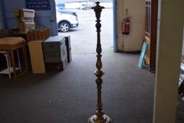 A gilt painted carved wooden standard lamp