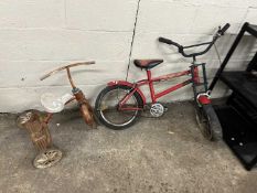 A child's trike together with a child's bike