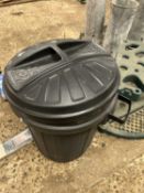 A plastic garden bin together with a gutter brush
