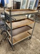 A vintage workshop storage rack on casters