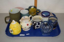 A tray of mixed wares to include Poole Pottery crocus vase, various decorated jugs, frilled glass