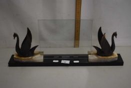 An Art Deco style bronzed metal and polished marble photograph frame with swan mounts