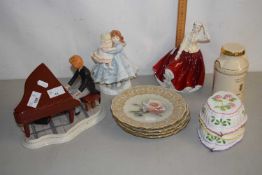 A ceramic model of a piano player