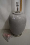 A large crackle glazed table lamp