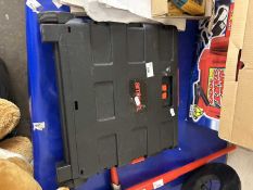 A folding plastic trolley