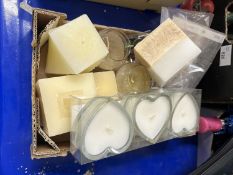 Box of assorted pin badges and candles