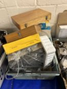 A slide projector and various circular slide magazines