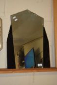An Art Deco wall mirror with black glass side panels and clip frame