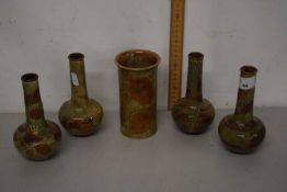 A group of four Royal Doulton leaf pattern stem vases and a further cylindrical vase (5)