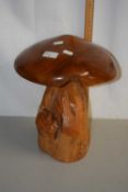 A polished hardwood toadstool