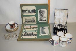A plated set of cake forks and two glass mustard pots with silver rim and two small spoons and a