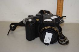 An S7000 digital camera with Fuji zoom lens