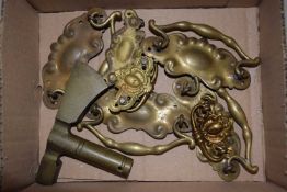 Small box containing a quantity of brass handles and door knockers