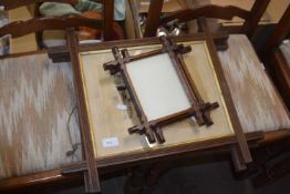 Two framed black and white photographs, together with two further frames