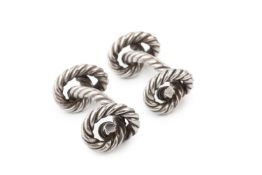 A pair of silver knot cufflinks by Hermes, of ropetwist design, marked HGB and one stamped HERMES