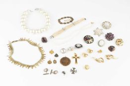 A single strand uniform cultured pearl necklace, the 18k gold clasp set with a split pearl, and