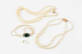 A twin strand graduated cultured pearl necklace, and another similar, both with 9ct gold clasps, a