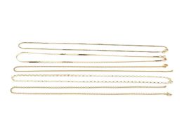 A 14k gold necklace, of flattened form, 43cm long, three 9ct gold fine link necklaces, and another