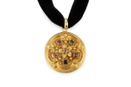 A yellow precious metal and gem set acrostic memorial locket, of circular form, relief decorated