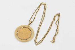 A gold Bayer commemorative medallion, the pendant mount stamped 585, on trace link chain stamped