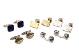 A pair of silver and haematite cufflinks, of curved circular design, and four further silver pairs