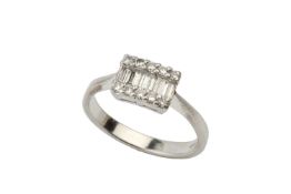 A diamond dress ring, channel set with six rectangular cut stones within two rows of round