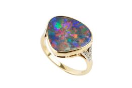 An opal and diamond ring, the opal of rounded triangular shape, collet-set to an unmarked yellow