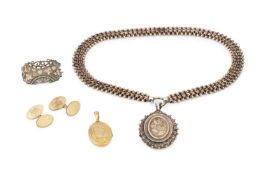 A pair of 9ct gold oval cufflinks, engraved with initials, and a 9ct gold oval locket pendant,