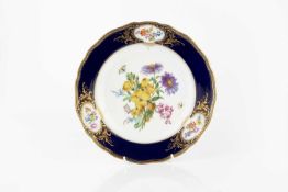 A late Meissen cabinet plate, painted with a spray of flowers and insects within gilt heightened