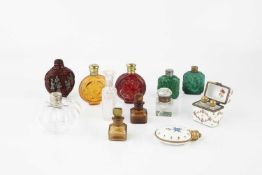 A Continental gilt metal mounted oval porcelain scent bottle, painted with flowers and with gilt