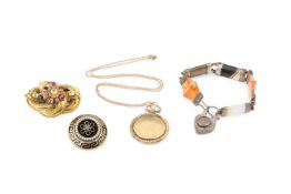 A Victorian yellow metal and gem set knot brooch, with cannetille decoration and set with pink and