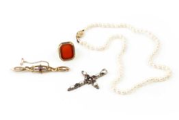 A 9ct gold and carnelian signet ring, inset with chamfered rectangular plain carnelian plaque, a