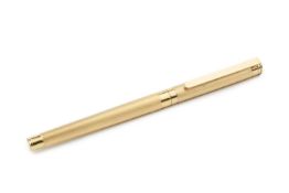 A MontBlanc gold plated fountain pen, with reeded decoration and 18ct gold nib stamped 750, 14cm