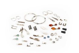 A collection of silver jewellery, to include two bangles, various neck chains, approx 20 pairs of