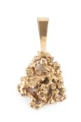 An Australian yellow gold nugget pendant, of abstract form, the bale stamped both 14ct and 375, 7.