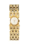 A 14k gold lady's wristwatch, the circular silvered dial inscribed Kraemer, on wide gatelink