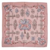 A 'Ferronnnerie' silk scarf by Hermès, designed by Cathy Latham, decorated in shades of pale pink