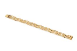 A 9ct gold bracelet, composed of linked pierced and textured panels, the clasp stamped 375, 18.5cm