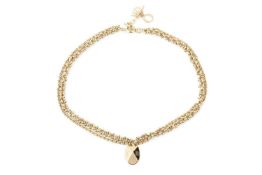 A gold plated multi-strand necklace by Christian Dior, with faceted oval pendant, and clasp hung