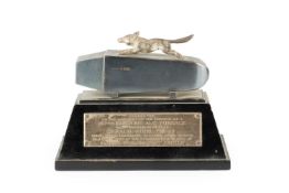 A silver presentation model of a running fox, upon an ingot, by Gladwin Ltd, Sheffield 1954, the
