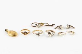 A diamond two stone ring, the collet set stones in a crossover design to a yellow metal shank, a
