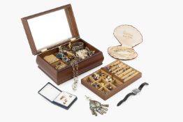 A large quantity of assorted costume jewellery, to include a hinged silver bangle, an oval shell