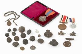 A George V Imperial Service medal, cased, a George V Special Constabulary faithful service medal,