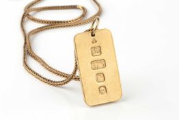 A 9ct gold rectangular ingot pendant, 3.5cm long, on 9ct gold herringbone link chain approx 28.6g