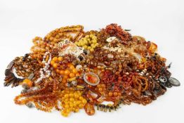 A large collection of simulated amber and other bead necklaces, to include two carnelian examples, a