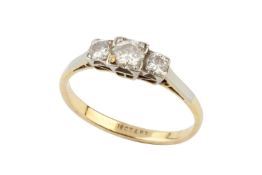A diamond three stone ring, the graduated brilliant-cut stones claw set in platinum to an 18ct