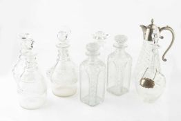 Two pairs of early 19th century cut glass decanters and stoppers, four other glass decanters and